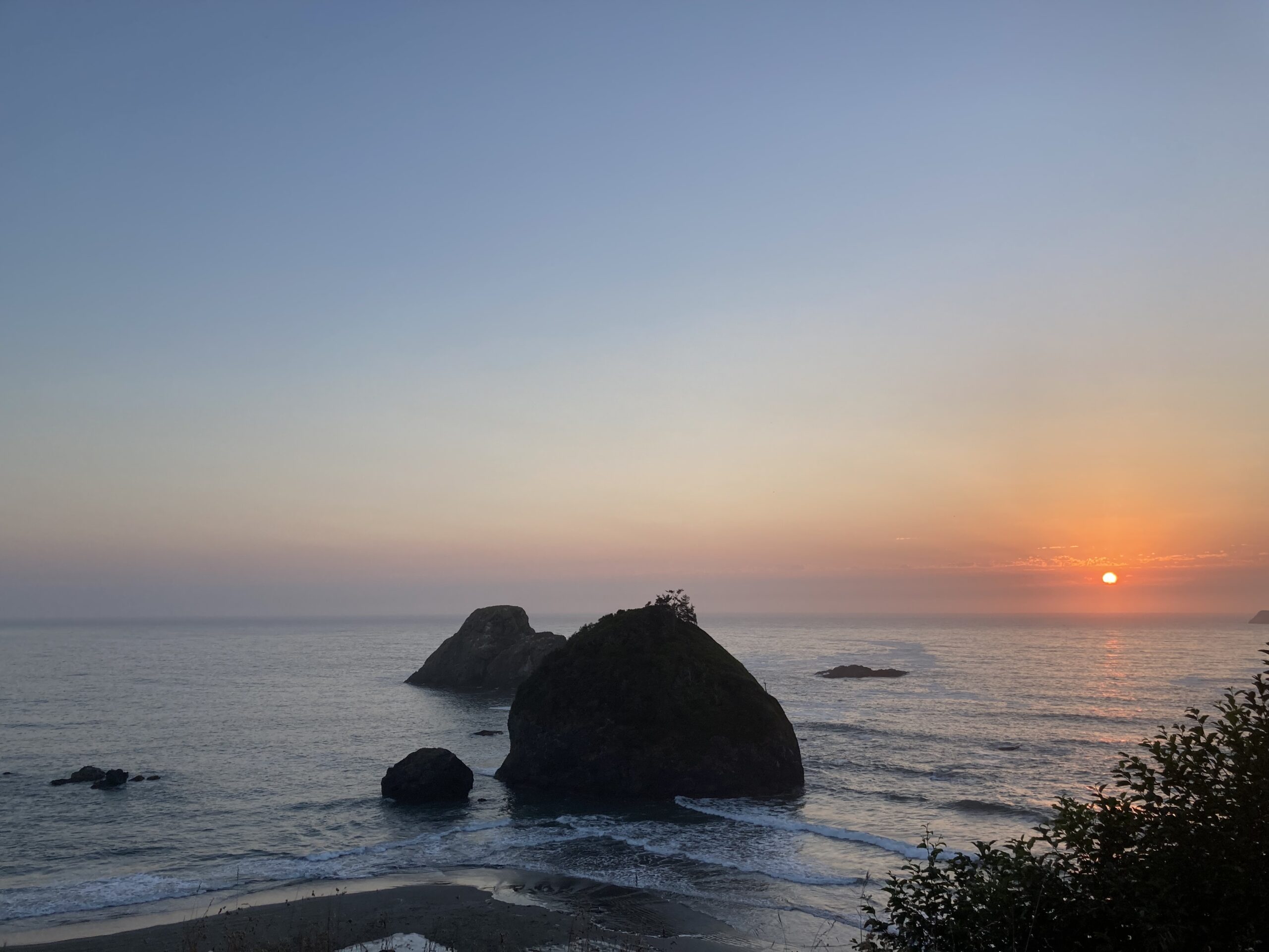 Rock in the sea and sunset