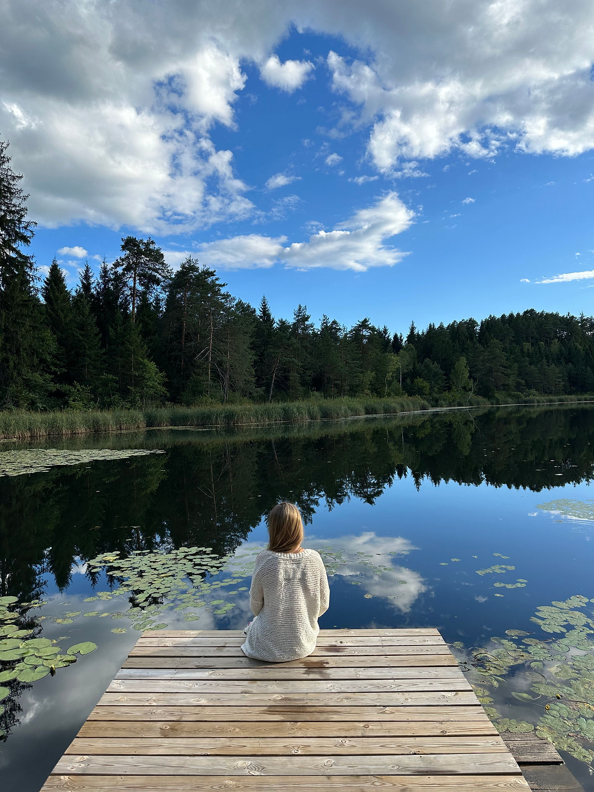 woman sitting close to water