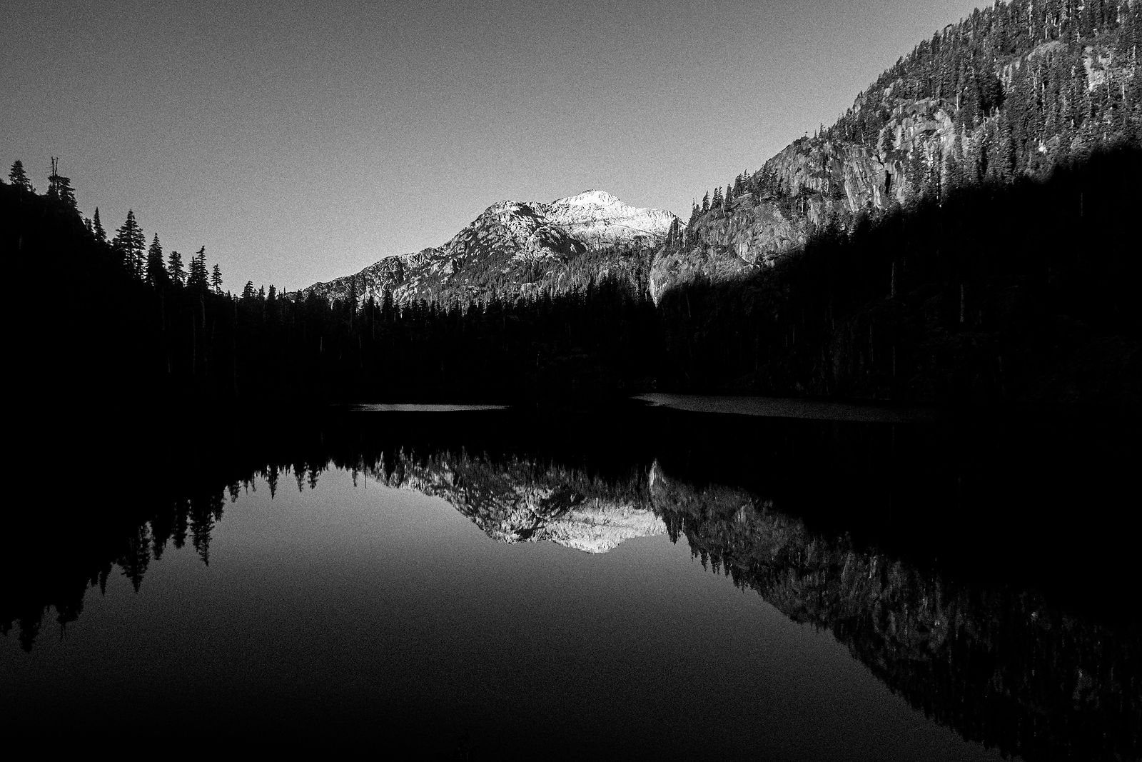 black and white picture of a mountain lake